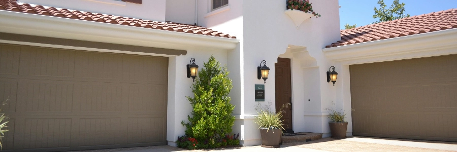 A house with two brown garage doors