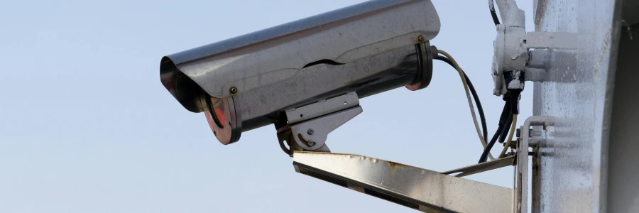 Close-up of a black and white CCTV surveillance camera