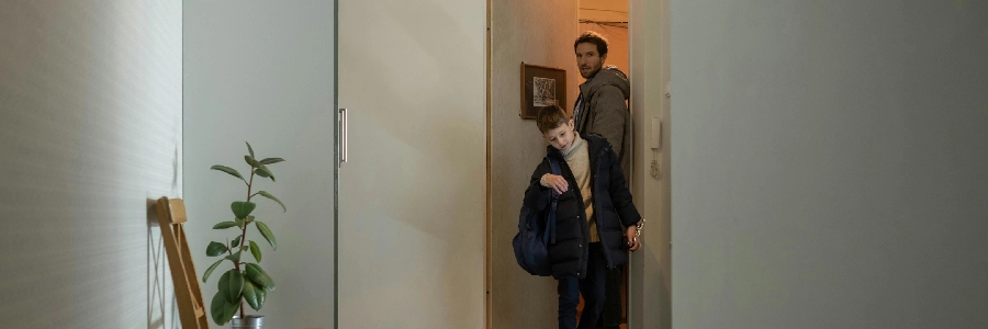 Father and son using the smart lock's auto-unlock function