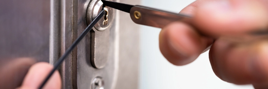 Man trying to fix his locked car door