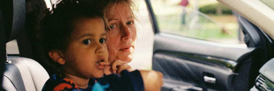 a person and a child in a car