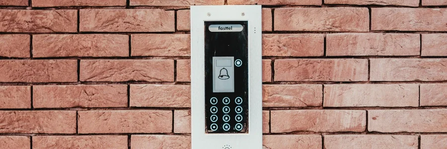 electronic keypad on brick wall