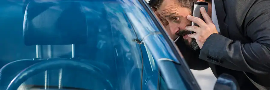 man expecting help after car keys locked inside car