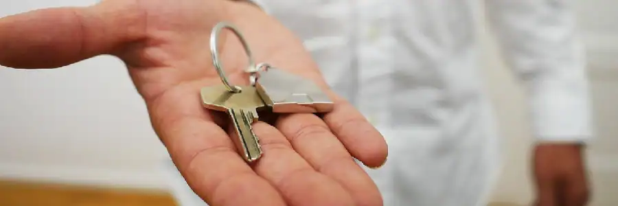 man with a spare key on his hand