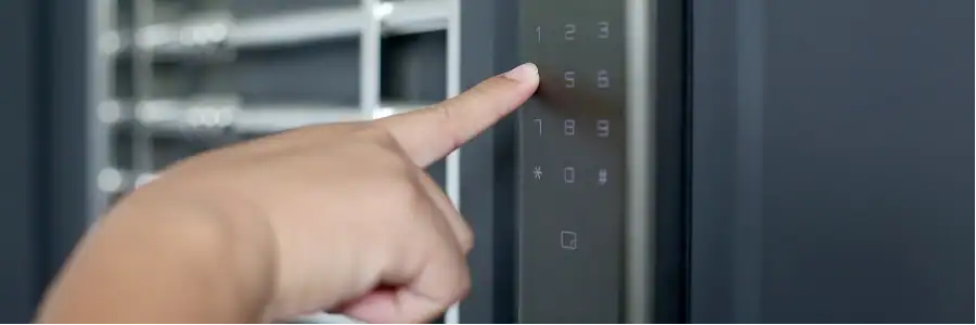 person setting code on smart lock