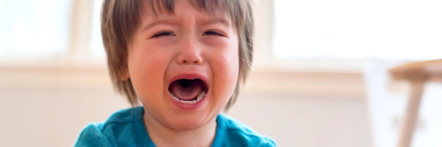 son crying inside house