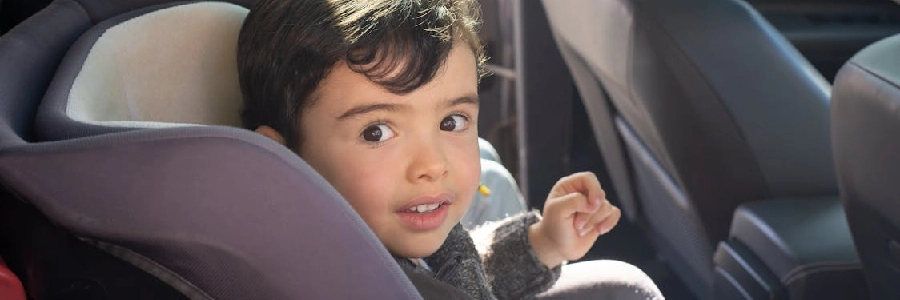 two children sitting in a car
