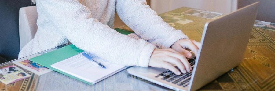 woman customizing her home\'s door access on a laptop