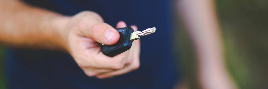Man holding a car key