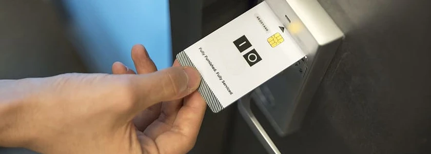 Person using card to open lock