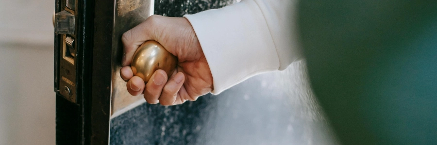 person opening a door